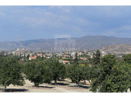 Residential land for sale in Pyrgos village with plans and permits for two houses