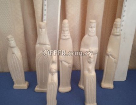 8 hand made soap stone statues.