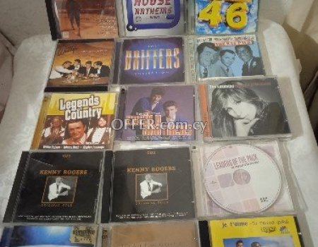 74 original slightly used CDs. - 2