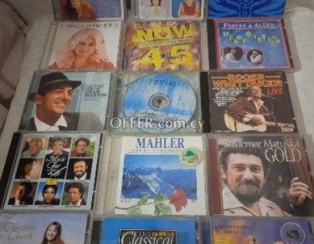 74 original slightly used CDs. - 1