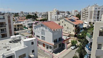 Three storey semi-detached mixed use building with attic in Strovolos,